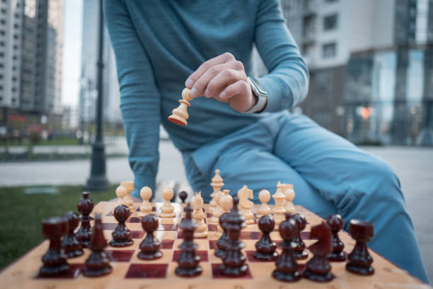 istock outside picture of man that keep chess pawn on board 1488242120