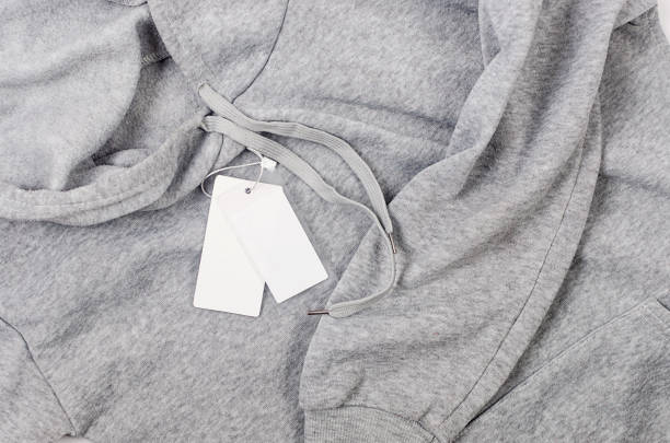 istock White empty Clothing Tag on a gray hoodie 1488242500