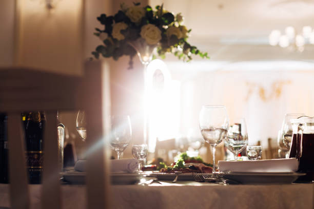 istock wedding banquet. festive table with dishes and drinks. bouquet o 1488244297