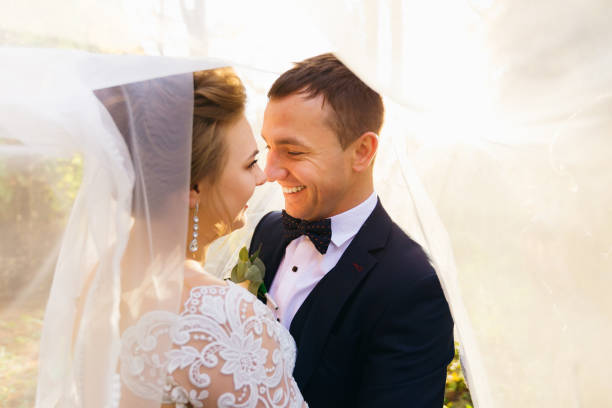 Happy bride and groom walking on virgin load