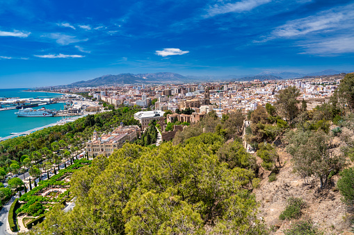 Malaga, Spain - April 14, 2023: Aerial view of Malaga port and city skyline from Gibralfaro Castle.
