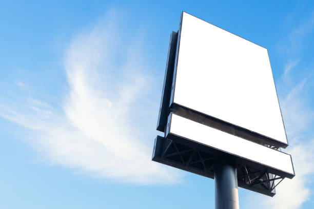 istock Blank white billboard sign against sky background 1488249803