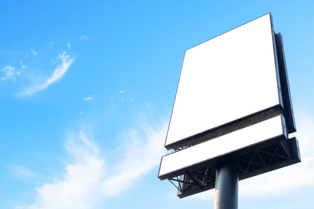 istock Blank white billboard sign against sky background 1488249811