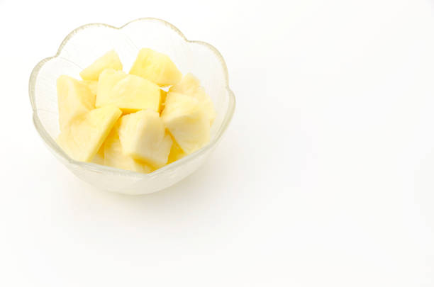 Fresh Ripe pineapple slices in a glass bowl