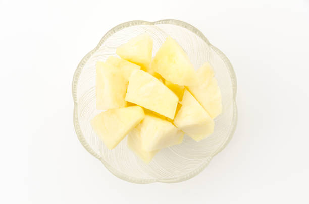 Fresh Ripe pineapple slices in a glass bowl