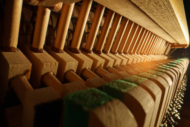 istock Inside the piano. Close-up view of hammers and strings inside the upright piano. 1488252716