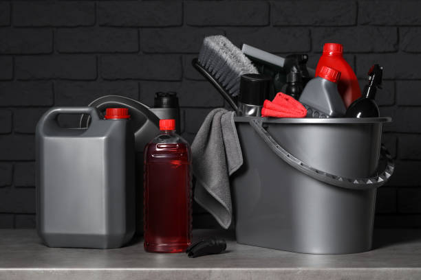 istock Different car cleaning products on grey table near black brick wall 1488253978
