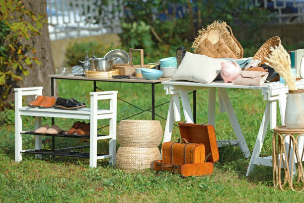 istock Small tables with many different items on garage sale in yard 1488254049