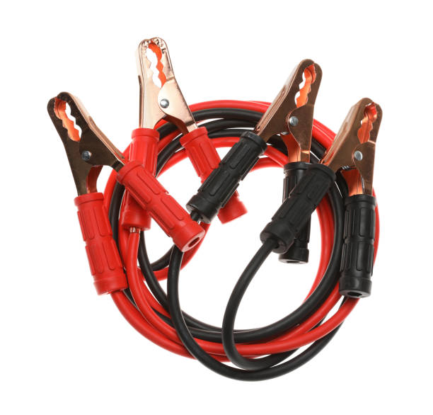 istock Battery jumper cables isolated on white, top view. Car safety 1488254056