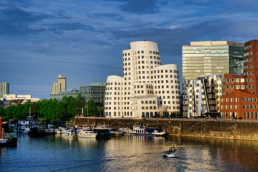 duesseldorf's media harbor with the Gehry buildings in the warm evening light