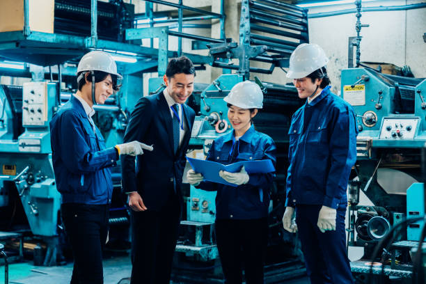 istock Businessman in a suit inspecting a factory 1488262982