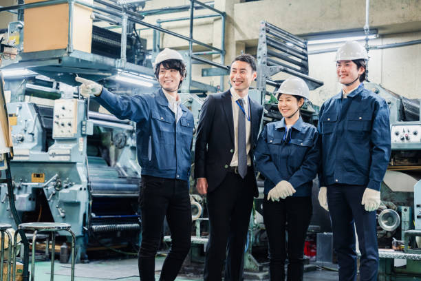 istock Businessman in a suit inspecting a factory 1488262984