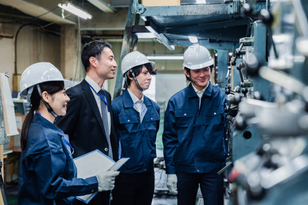 istock Businessman in a suit inspecting a factory 1488262999