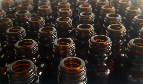 closeup photo of brown medicine bottle