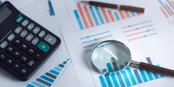 istock magnifying glass calculator graph statistics business data analysis concept ,manage financial and marketing documents ,Statistics and Data Concepts ,update annual budget accounts 1488275546