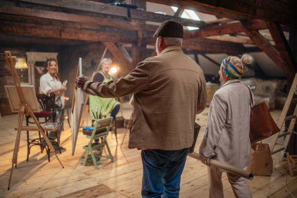 istock group of seniors attending art class with teacher 1488277728
