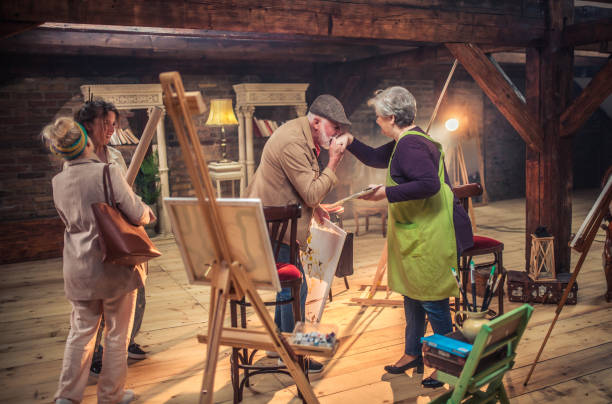 istock group of seniors attending art class with teacher 1488277778