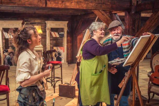 istock group of seniors attending art class with teacher 1488277810