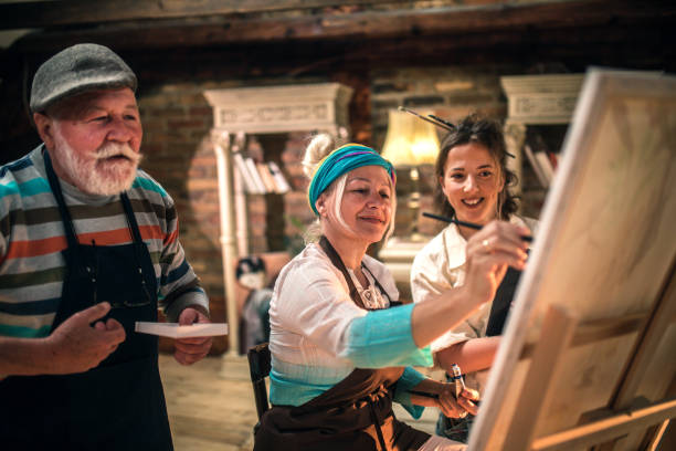 istock group of seniors attending art class with teacher 1488277851