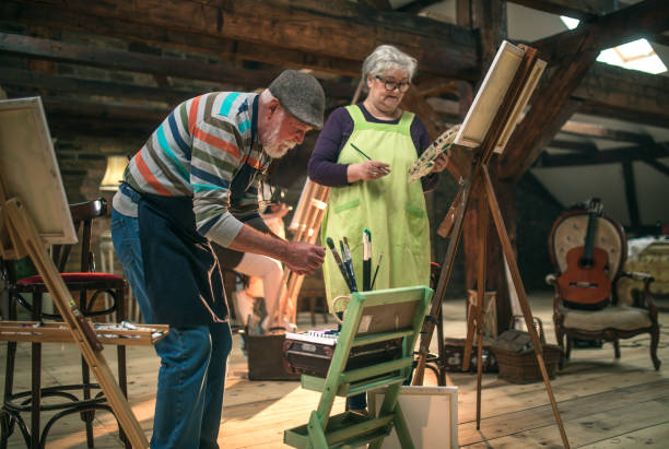istock group of seniors attending art class with teacher 1488277885