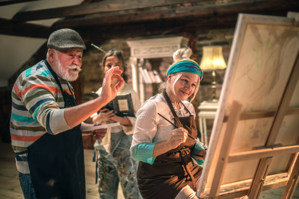 istock group of seniors attending art class with teacher 1488277921