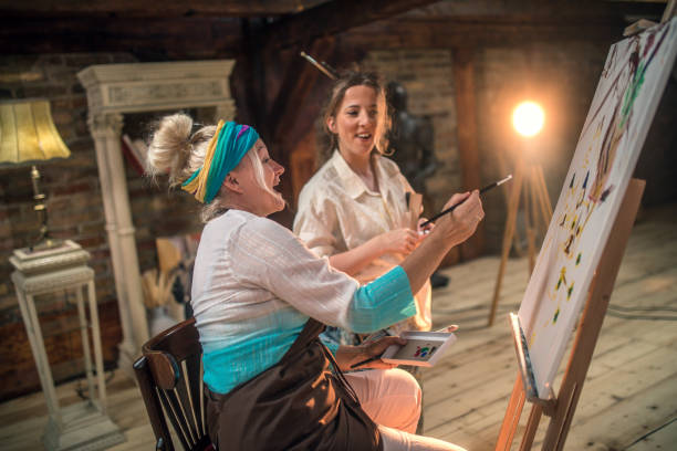 istock group of seniors attending art class with teacher 1488277932