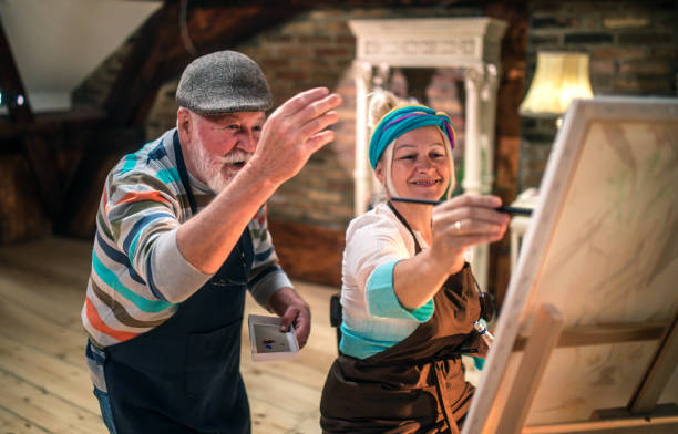 istock group of seniors attending art class with teacher 1488277942