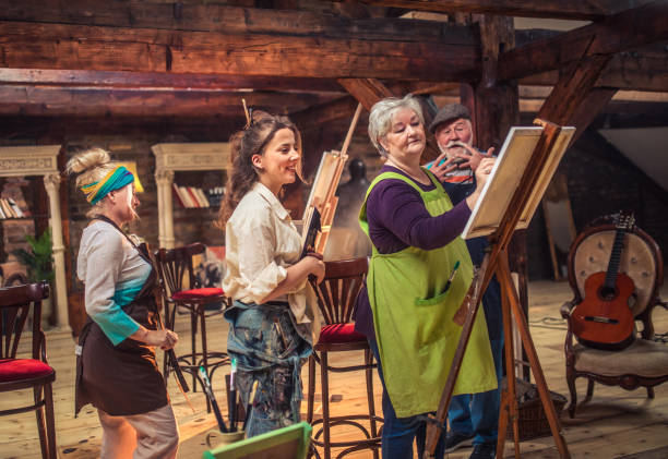 istock group of seniors attending art class with teacher 1488277956