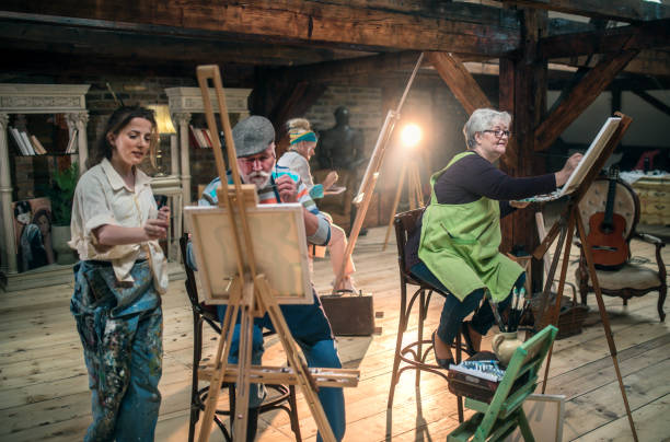 istock group of seniors attending art class with teacher 1488277980