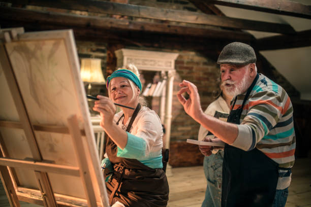 istock group of seniors attending art class with teacher 1488278016
