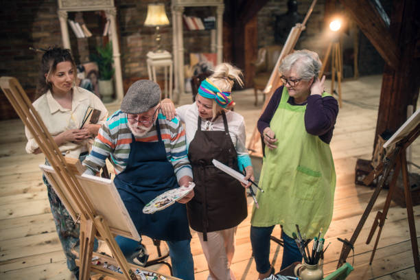 istock group of seniors attending art class with teacher 1488278568
