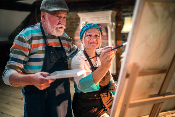 istock group of seniors attending art class with teacher 1488278574