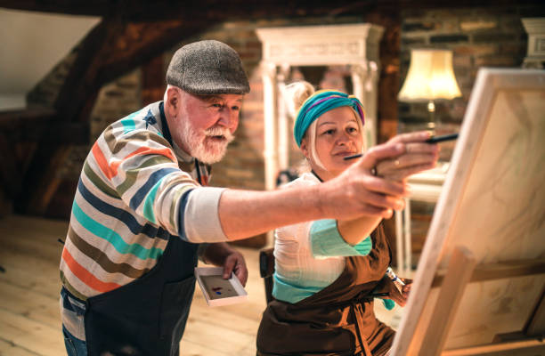 istock group of seniors attending art class with teacher 1488278741