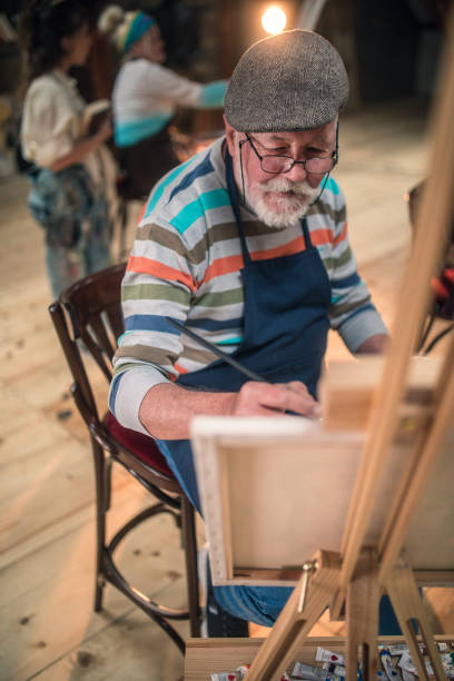istock group of seniors attending art class with teacher 1488278742