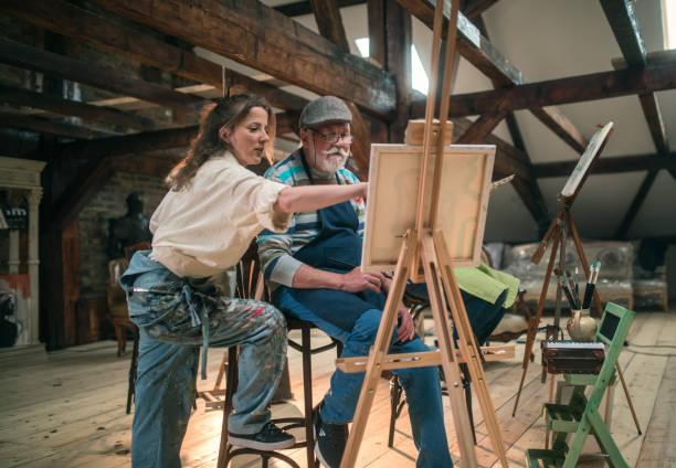 istock group of seniors attending art class with teacher 1488278808
