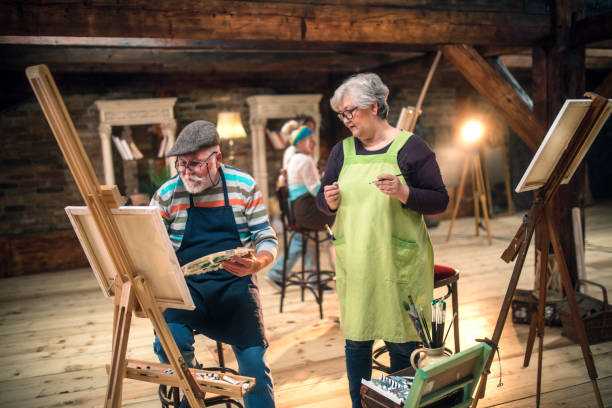 istock group of seniors attending art class with teacher 1488278852