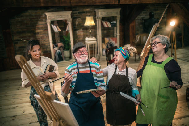 istock group of seniors attending art class with teacher 1488278908