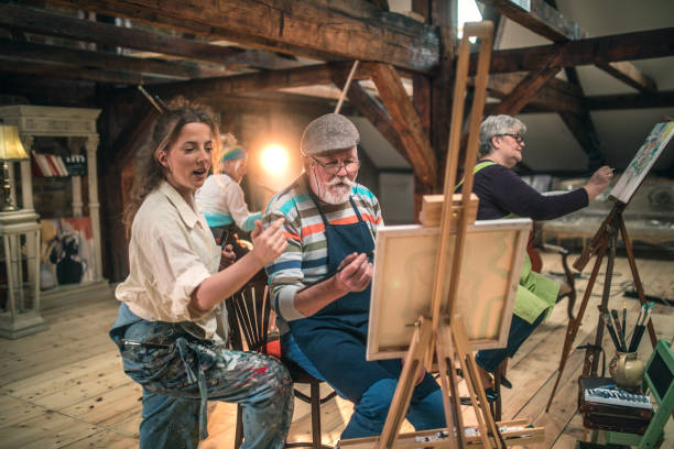 istock group of seniors attending art class with teacher 1488278938