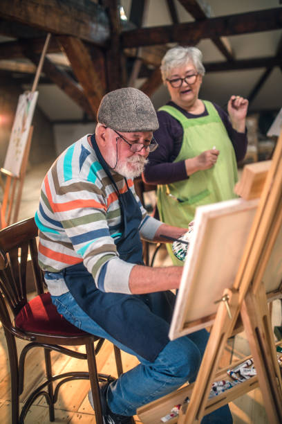 istock group of seniors attending art class with teacher 1488278967