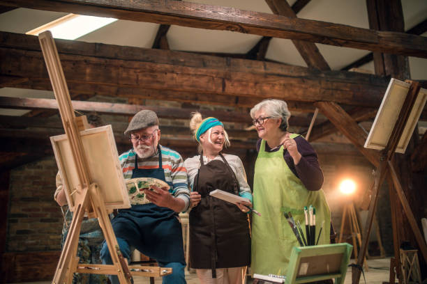 istock group of seniors attending art class with teacher 1488278968