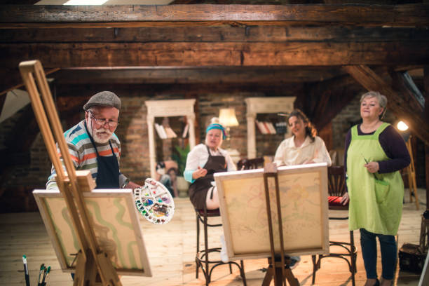 istock group of seniors attending art class with teacher 1488278997