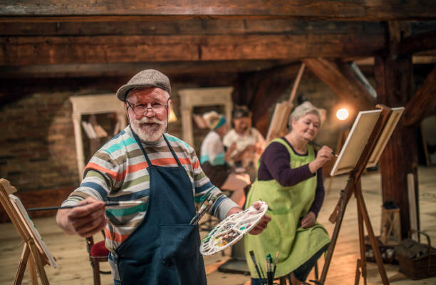 istock group of seniors attending art class with teacher 1488279006