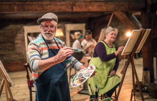 istock group of seniors attending art class with teacher 1488279029