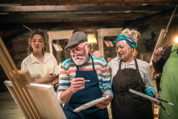 istock group of seniors attending art class with teacher 1488279055