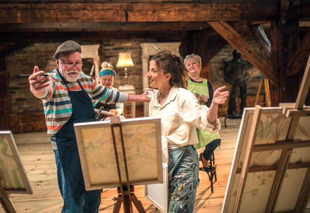 istock group of seniors attending art class with teacher 1488285067