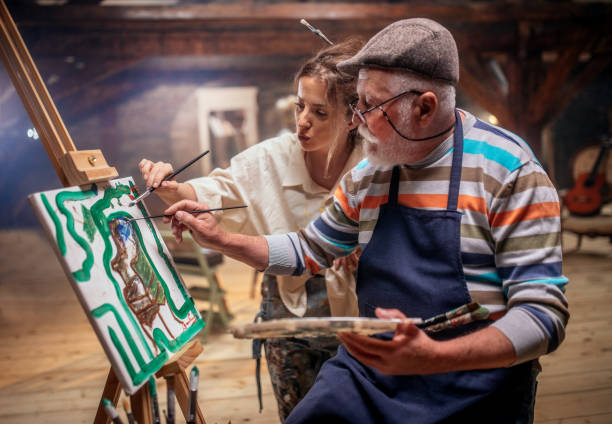 istock group of seniors attending art class with teacher 1488285110