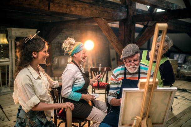 istock group of seniors attending art class with teacher 1488285111