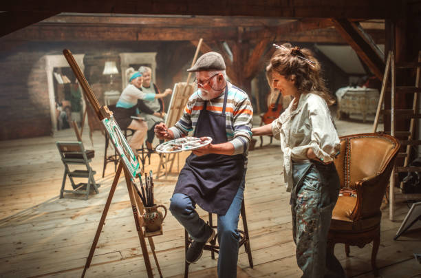 istock group of seniors attending art class with teacher 1488285130