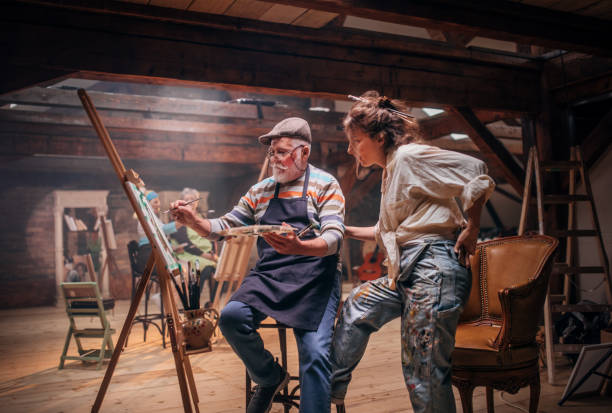 istock group of seniors attending art class with teacher 1488285162