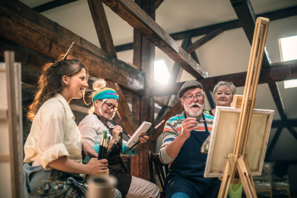 istock group of seniors attending art class with teacher 1488285165